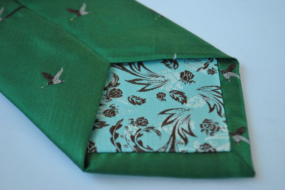 dark green tie with flying duck design